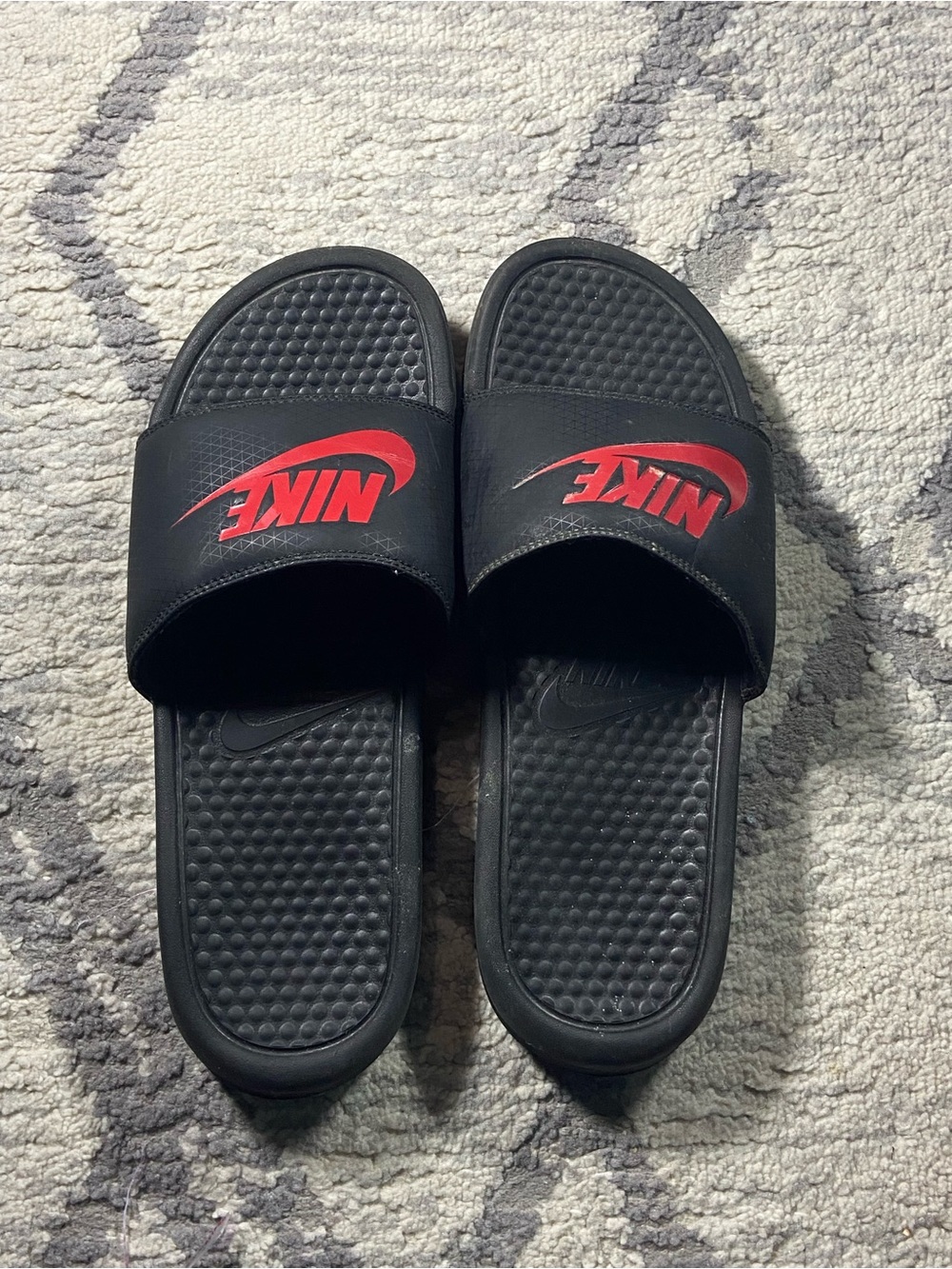 Nike Black Slide Sandals with Red Swoosh Logo